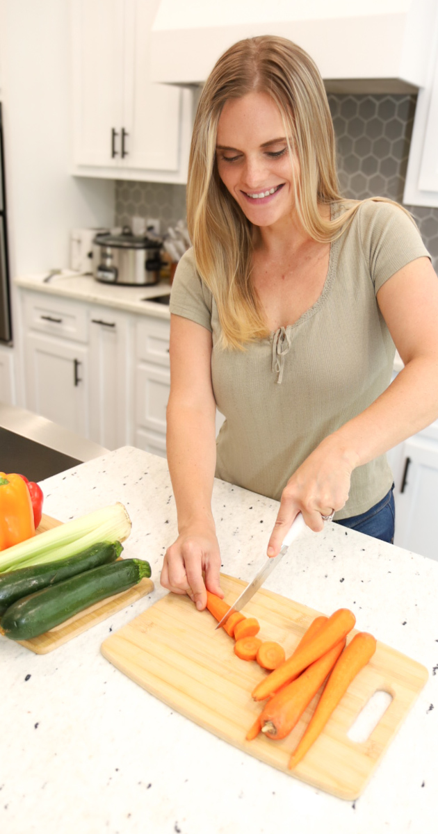 Rachel cutting carrots and preparing a meal, healthy lifestyle